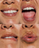 Close-up of a person's mouth showing different shades of skin and teeth.
