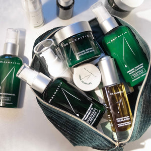 Collection of skincare products from Dr. Alkaitis on a white background