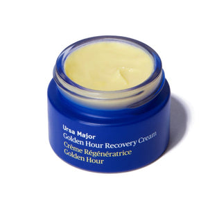 Blue jar of Golden Hour Recovery Cream on a white background