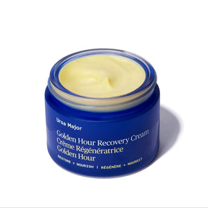 Blue jar of Golden Hour Recovery Cream on a white background