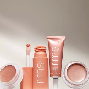 RMS beauty makeup products on a neutral background