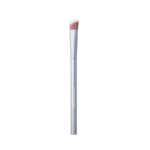 Makeup brush with pink bristle head on a white background