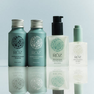 Set of ROZ skincare products on a light blue background