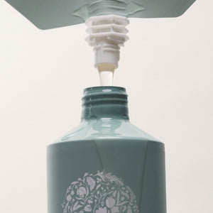 Bottle of Röz with a dropper on a light gray background