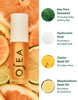 OSEA lip balm with ingredients listed on a background of citrus fruits