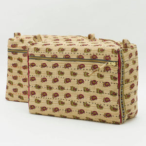 Beige fabric bag with floral pattern on a white background