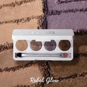 Makeup palette with shades and brushes on a textured surface