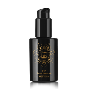 A black pump bottle with gold accents labeled 'Siam Seas Bua Sacred Protection Face Cream', designed for firming and brightening the skin.