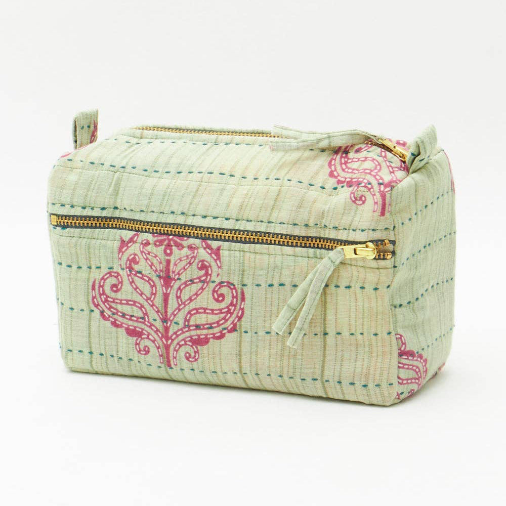 Fabric pouch with pink floral patterns on a white background