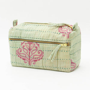 Fabric pouch with pink floral patterns on a white background