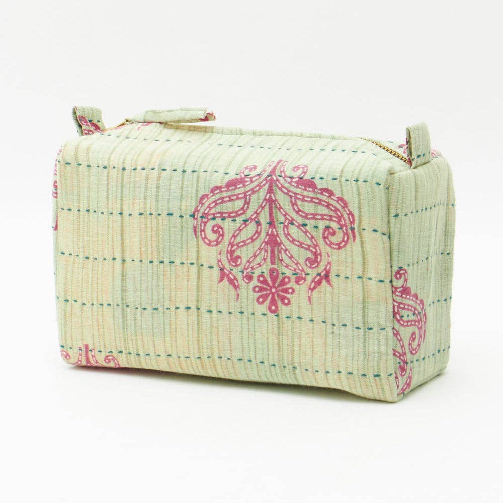 Fabric pouch with pink floral patterns on a white background