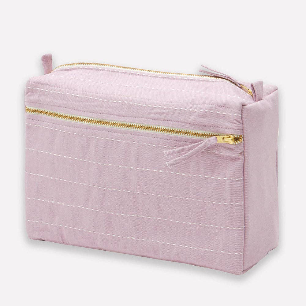 Pink pouch with gold zipper on a white background