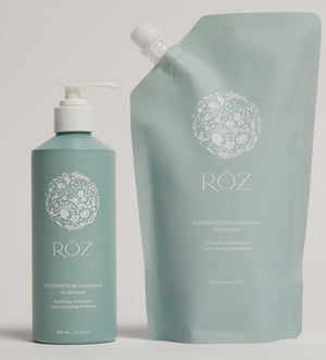 Röz shampoo bottle and conditioner pouch on a light gray background