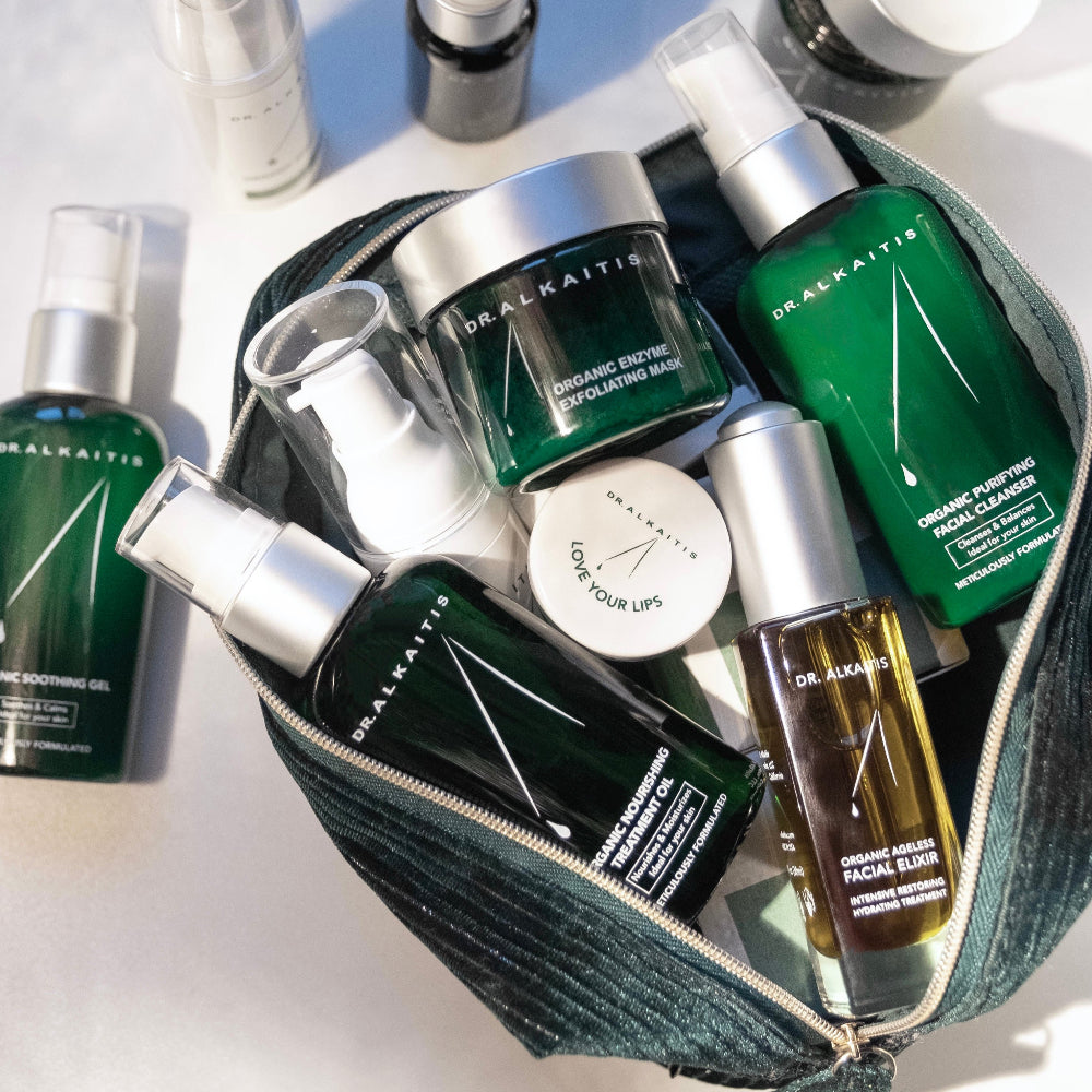 Collection of skincare products from Dr. Alkaitis on a white background