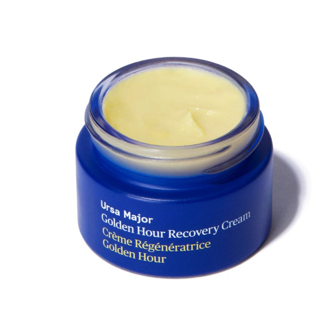 Blue jar of Ursa Major Golden Hour Recovery Cream on a white background