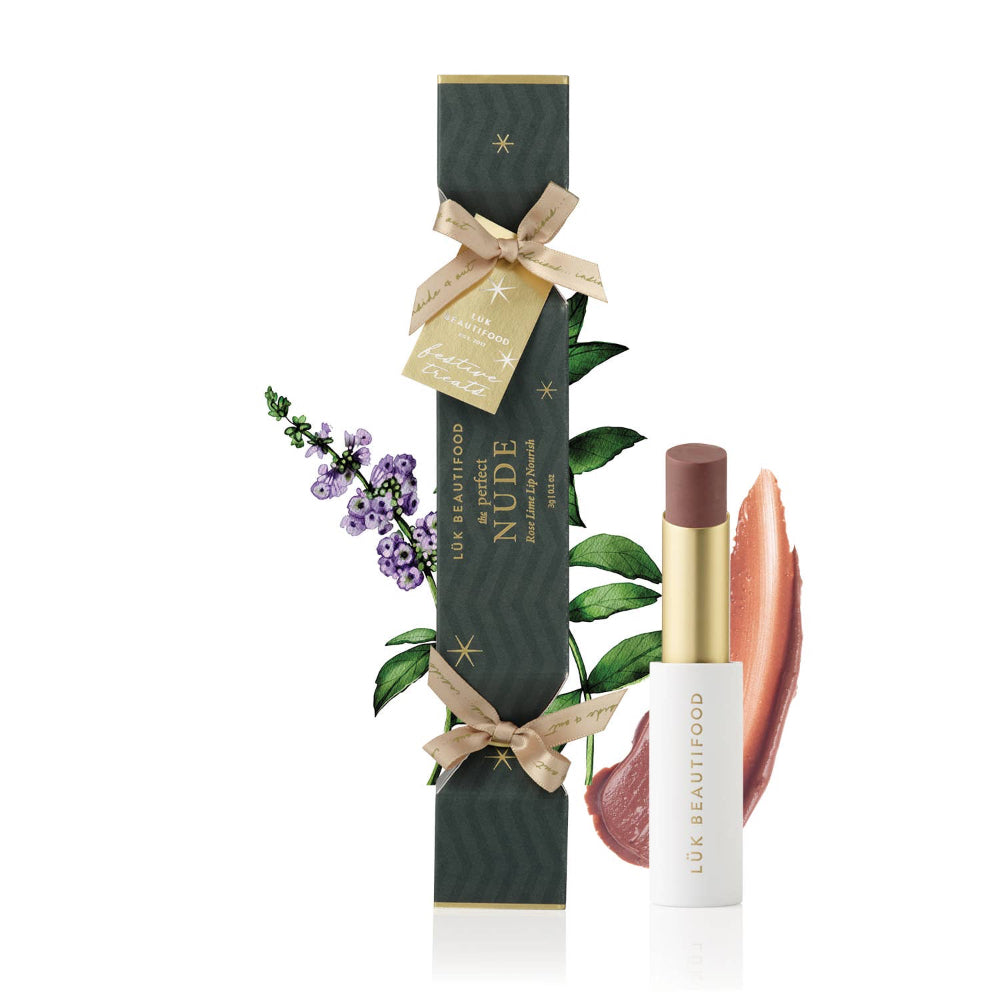 Lip balm with packaging featuring a bow and floral elements on a white background