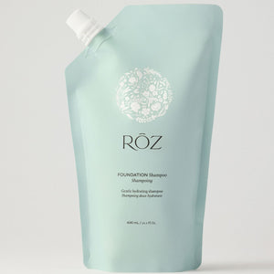 Light blue shampoo bottle with 'Röz' branding on a white background