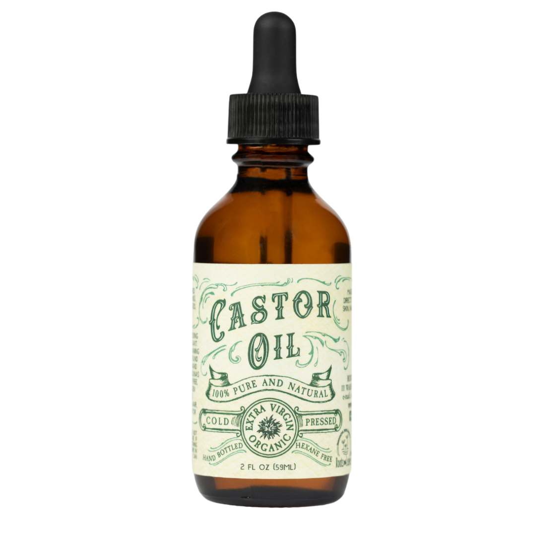 Bottle of castor oil with a dropper on a white background
