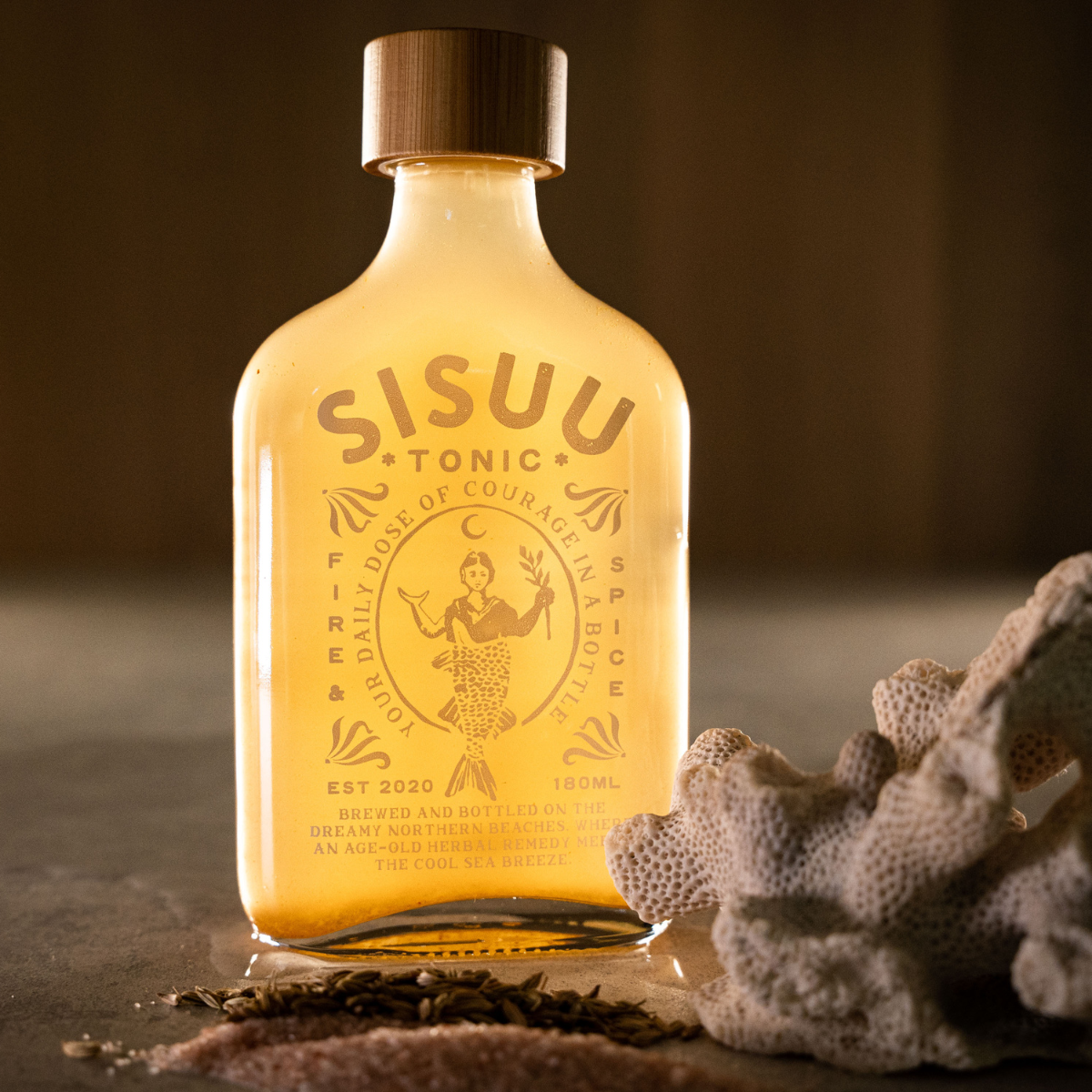 SISUU Tonic bottle with a wooden cap on a light gray background