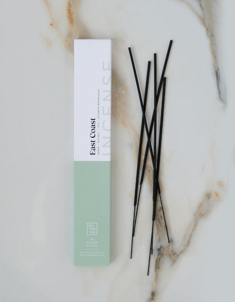 Incense sticks with packaging on a marble surface