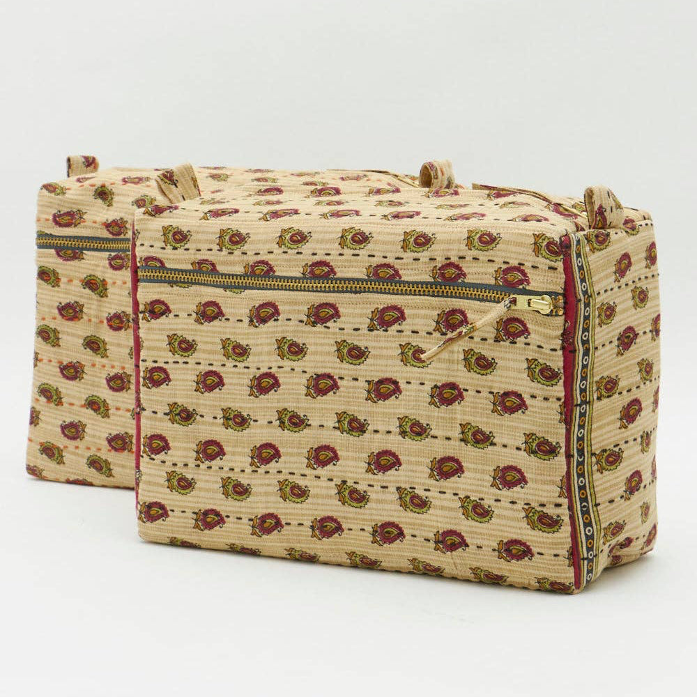 Beige fabric bag with floral pattern on a white background