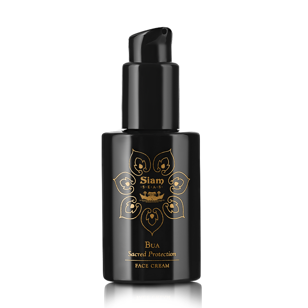A black pump bottle with gold accents labeled 'Siam Seas Bua Sacred Protection Face Cream', designed for firming and brightening the skin.